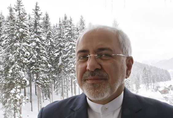 Mohammad Javad Zarif poses on the balcony after an interview with The Associated Press on the sideline of the World Economic Forum in Davos Switzerland Wednesday Jan. 20 2016. A prevailing sense of anxiety was in the