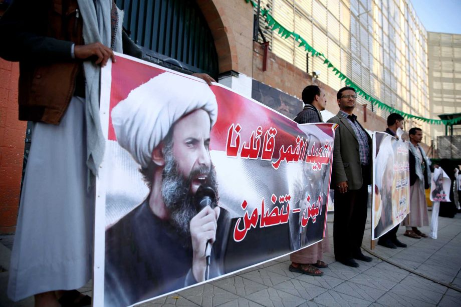 Shiite rebels known as Houthis hold posters of late Shiite cleric Nimr al-Nimr who was executed in Saudi Arabia during an anti Saudi protest outside the Saudi embassy in Sanaa Yemen Thursday Jan. 7 2016