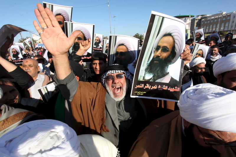 Iraqi men protest against the execution of Shiite Muslim cleric Nimr al Nimr in Saudi Arabia during a demonstration in Najaf