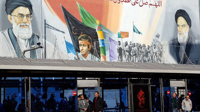 Iranians wait at a bus station in a street of the capital of Tehran Iran 16 January 2016