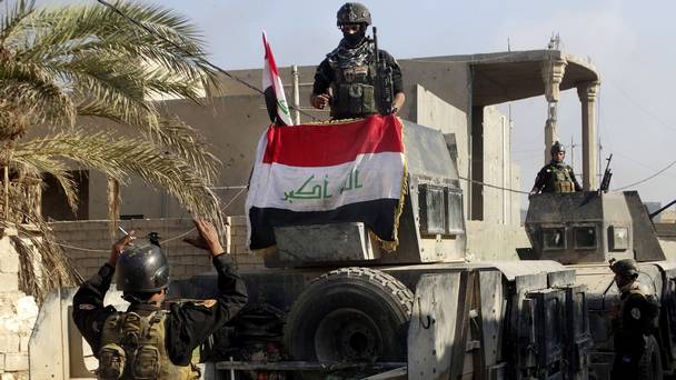 Iraqi security forces surround the government complex in central Ramadi