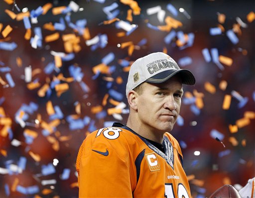 Denver Broncos quarterback Peyton Manning watches the AFC championship trophy presentation following the NFL football AFC Championship game between the Denver Broncos and the New England Patriots Sunday Jan. 24 2016 in Denver. The Broncos defeated the