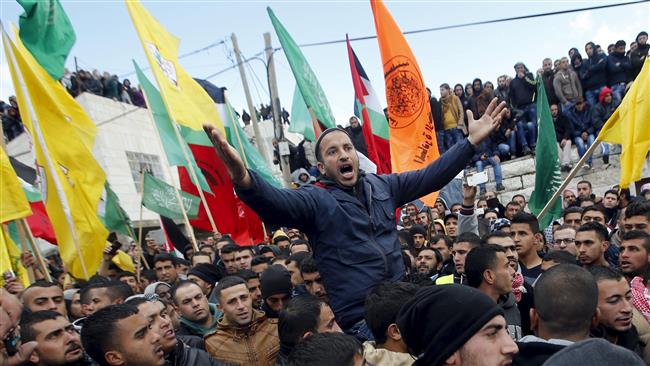 A mourner reacts during the funeral of four Palestinians who were shot dead by Israeli troops on Thursday in the occupied West Bank village of Sa’ir near al Khalil