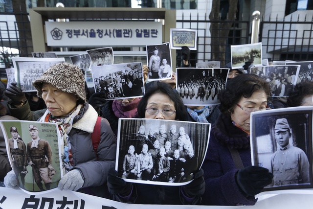 ASSOCIATED PRESS           South Korean bereaved family members of victims of World War II stage a rally demanding full compensation and apology from Japanese government in front of Foreign Ministry in Seoul on Monday