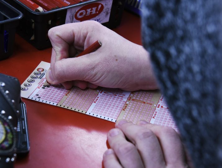 Jessica Anderson fills out Powerball ticket numbers at Dixie Deli Friday Jan. 8 in Fairfield. NICK GRAHAM  STAFF