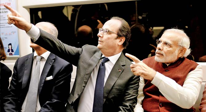 Jet set go French President Francois Hollande and PM Narendra Modi travel by Metro to Gurgaon to attend an event yesterday. Pic  PTI