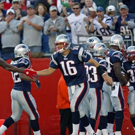 Foxboro MA 10/26/08 As Patriots running back Kevin Faulk is mobbed by teammates Matt Cassel is all smiles after his pass to Faulk in the fourth quarter that was the difference in the game as it broke a 16-16 tie and eventually gave N