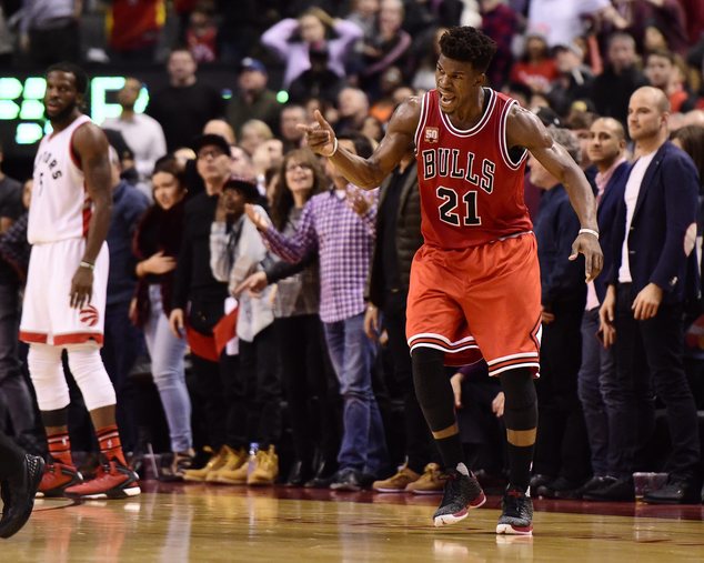 Chicago Bulls Jimmy Butler celebrates a three-point basket against the Toronto Raptors during second half NBA basketball action in Toronto on Sunday Jan. 3