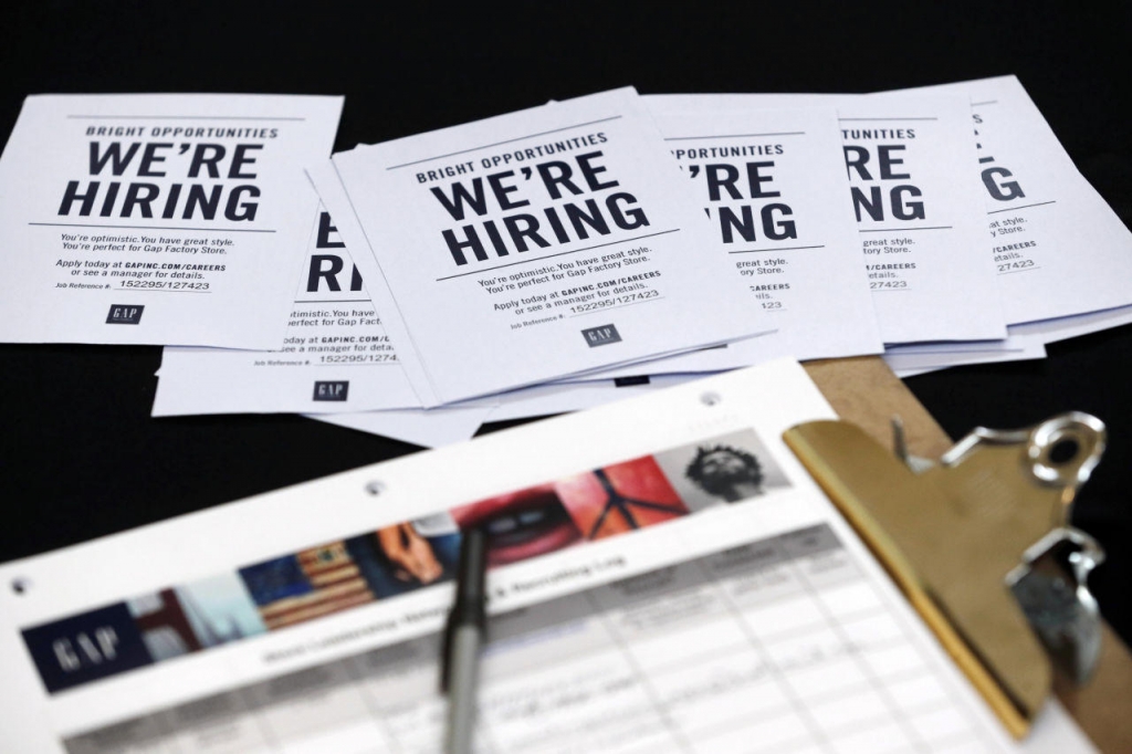 Job applications and information for the Gap Factory Store sit on a table during a job fair at Dolphin Mall in Miami on Oct. 6 2015