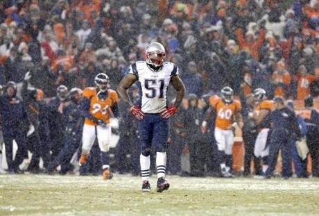 New England Patriots middle linebacker Jerod Mayo walks to the sidelines after a Denver Broncos touchdown during the second half of an NFL football game Sunday Nov. 29 2015 in Denver