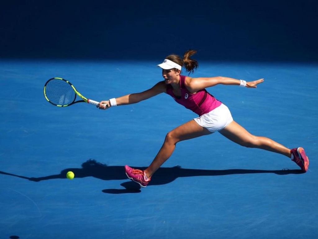 Johanna Konta scrambles to make a return against Angelique Kerber Getty