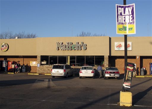 People stop at Naifeh's supermarket in Munford Tenn. Thursday Jan. 14 2016 where one of three winning tickets in the record Powerball jackpot was sold. The holder of the winning ticket will share the $1.6 billion jackpot with winners in Southern