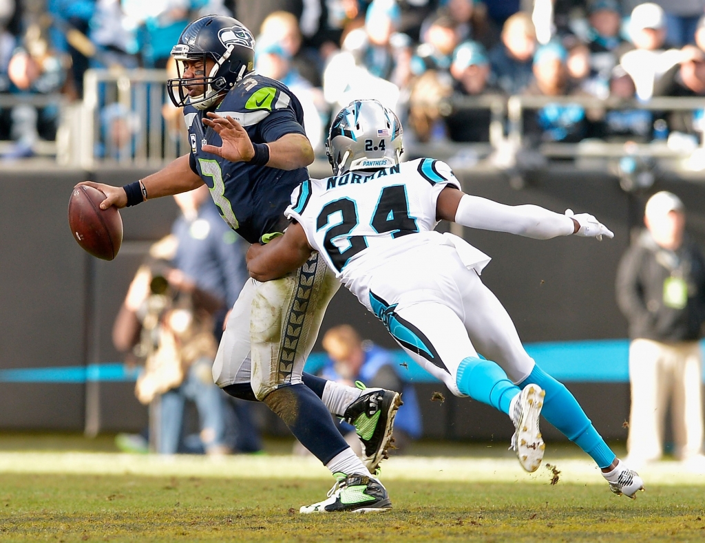 Josh Norman sacks Russell Wilson during the NFC Divisional Playoff game in Charlotte