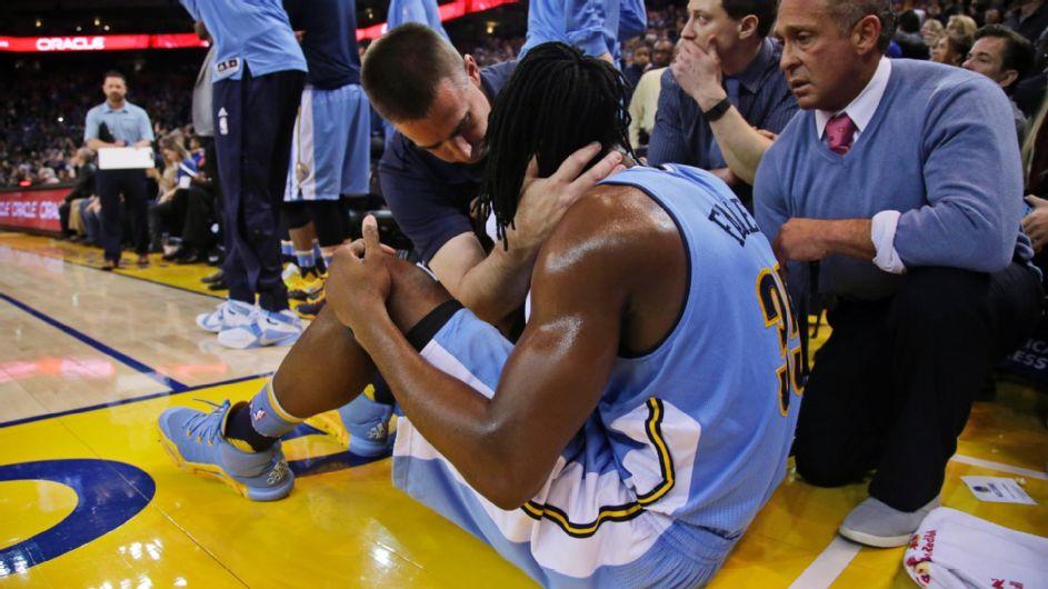 Kenneth Faried is stretchered off the court after a possible neck injury