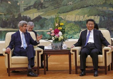 U.S. Secretary of State John Kerry talks with Chinese President Xi Jinping at the Great Hall of the People in Beijing China