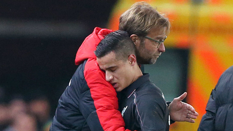 Klopp consoles Philippe Coutinho after the midfielder was taken off injured against Stoke