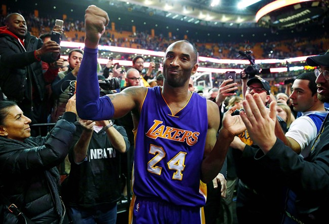 Los Angeles Lakers Kobe Bryant acknowledges the fans as he walks of the court in Boston after the Lakers 112-104 win over the Boston Celtics in an NBA basketball game Wednesday Dec. 30 2015