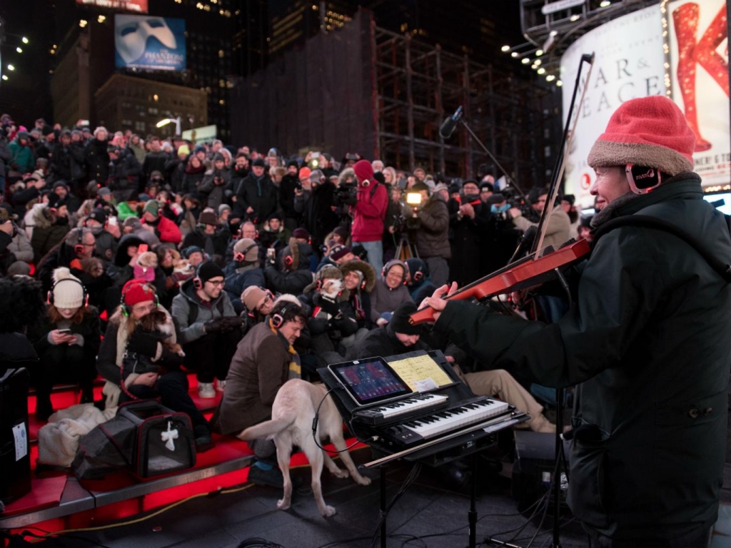 Laurie Anderson plays music at a low-decibel level for dogs in Times Square Getty Images