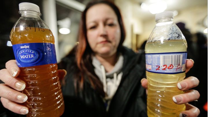 LeeAnne Walters of Flint shows water samples from her home.                  William Archie  Zuma