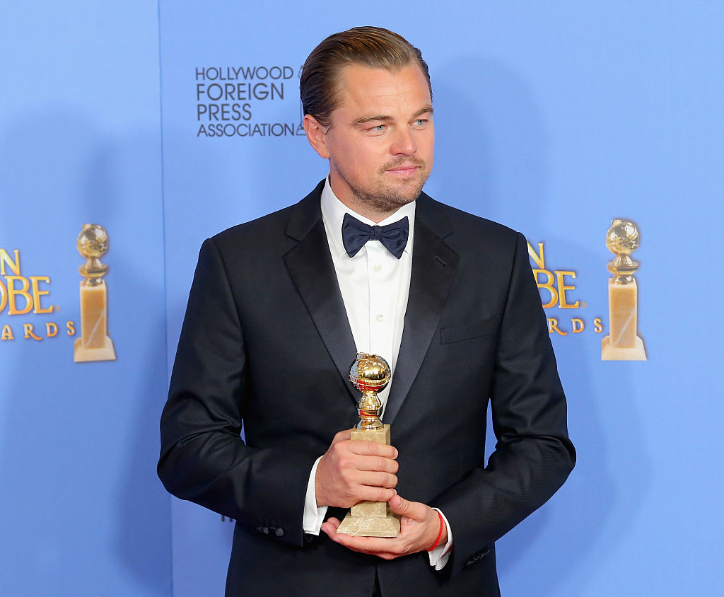 Leonardo Di Caprio holding his Best Actor trophy at the recently-concluded Golden Globes