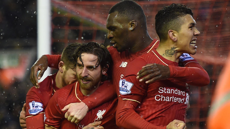 Liverpool celebrate their late equaliser against Arsenal