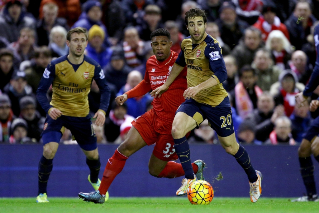 Liverpool's Jordon Ibe and Arsenal's Mathieu Flamini battle for the ball