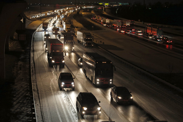 Traffic is bumper to bumper and mostly at a stand-still on the outer loop of the I-495 Capital Beltway after snow fell Wednesday Jan. 20 2016 in National