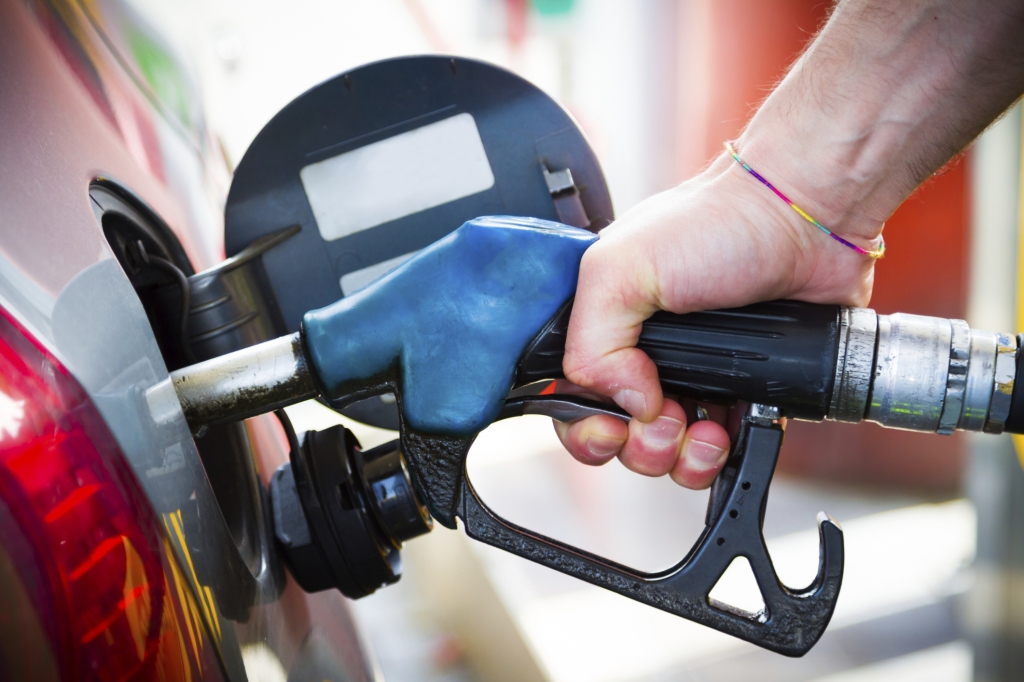 Pumping gas at gas station