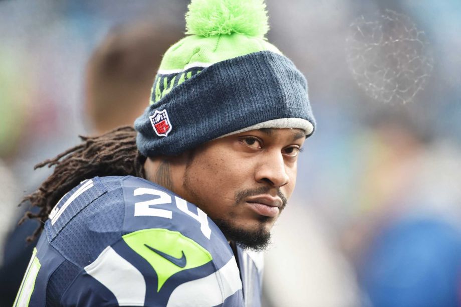 Marshawn Lynch of the Seattle Seahawks looks on before the NFC Divisional Playoff Game against the Carolina Panthers at Bank of America Stadium