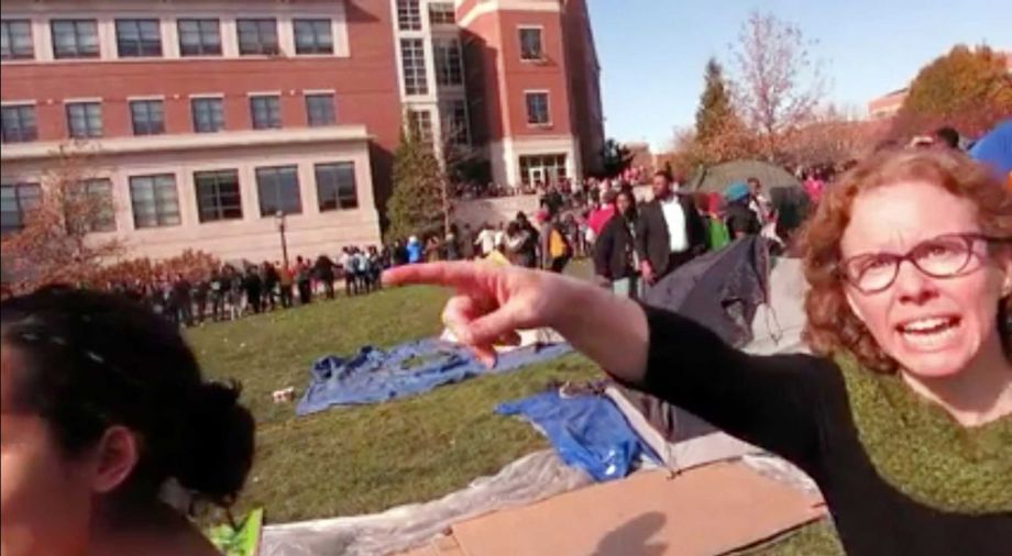 FILE- This Nov. 9 2015 file frame grab provided by Mark Schierbecker shows Melissa Click right an assistant professor in the University of Missouri's communications during a run-in with student journalists at a campus protest that followed the resign