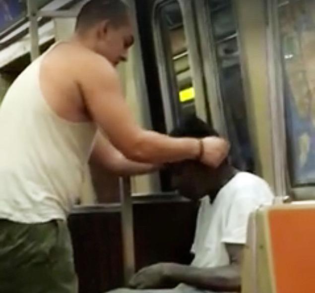 A video captured a man giving his shirt and hat to a shirtless shivering man on the subway