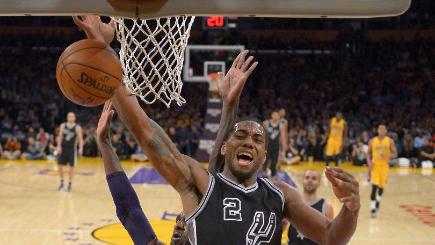 San Antonio Spurs forward Kawhi Leonard right battles away against the LA Lakers