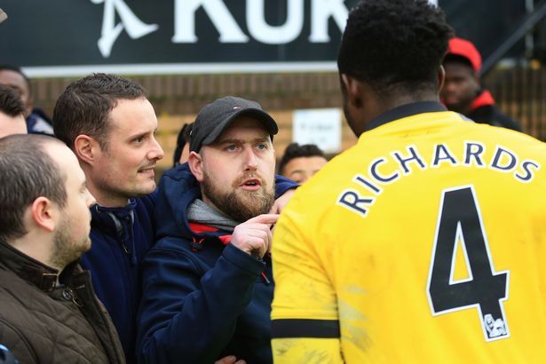 Micah Richards clashes with an angry fan