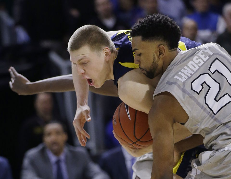 Marquette beats No. 8 Providence 65-64