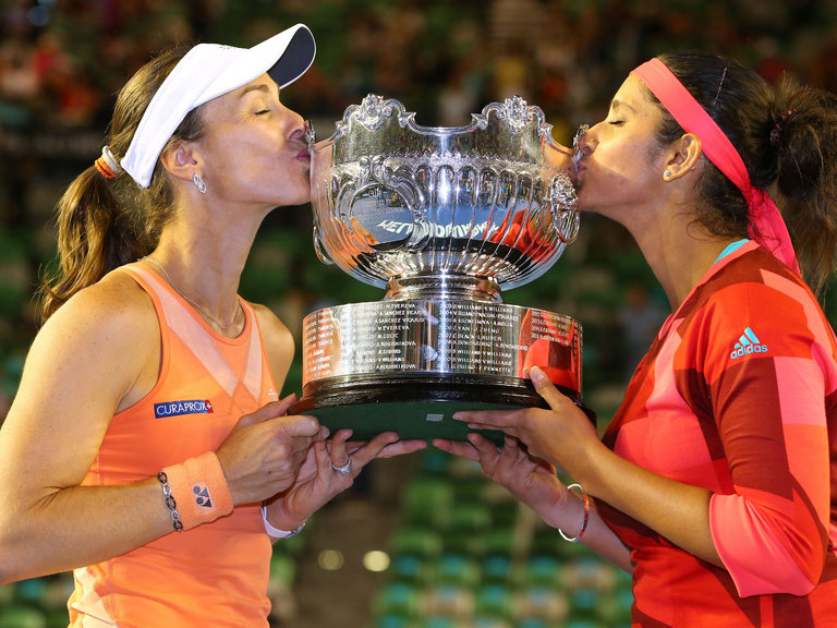 Martina Hingis and Sania Mirza celebrate with the trophy