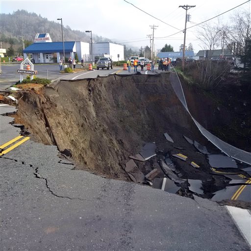 Oregon Department of Transportation shows a massive sinkhole that has opened up on a road near Highway 101 in the Curry County town of Harbor Ore. Signs have been placed along the highway directing traffic to a