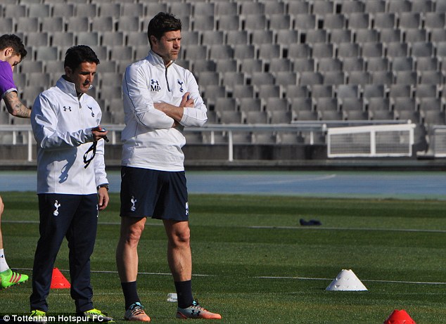 Mauricio Pochettino watches his Spurs players in training during a mid-season trip away for the squad