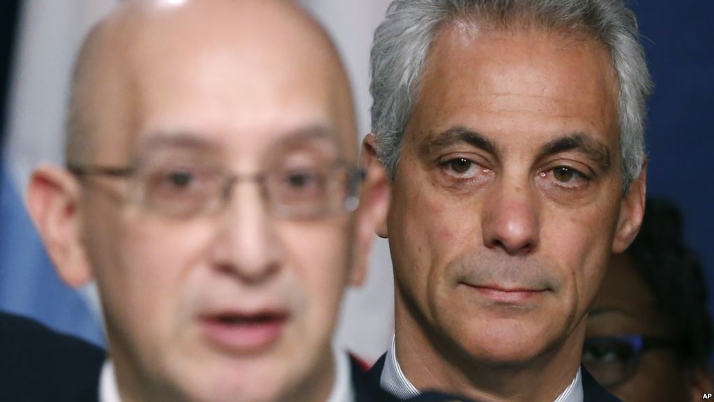 Chicago Mayor Rahm Emanuel right listens to Police Superintendent John Escalante during a news conference about new police procedures on Dec. 30 2015 in Chicago