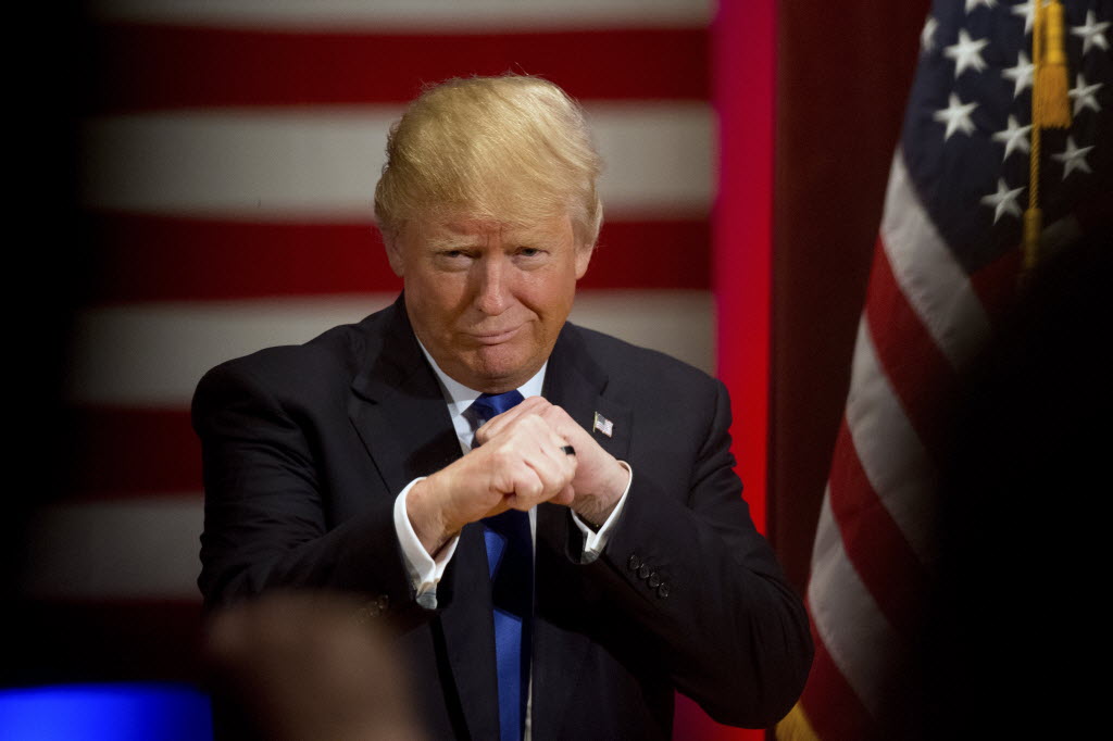 Republican presidential candidate Donald Trump poses with a ring given to him by a group of veterans during a campaign event on the campus of Drake University Thursday Jan. 28 2016 in Des Moines Iowa.  Donald Trump Andrew Har