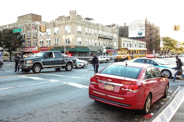 Members of the NYPD's Collision Investigation Squad investigate a serious crash in Bensonhurst before making an arrest