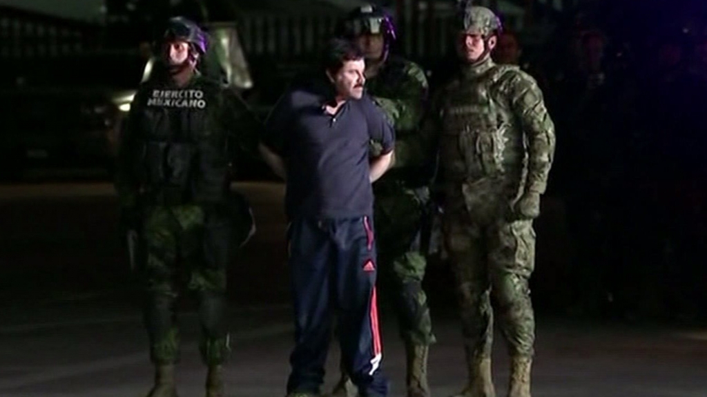 Mexican forces escorted Joaquin'El Chapo Guzman out of an armored vehicle and into a helicopter late Friday night following his arrest after months on the run