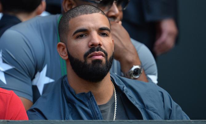 480046602-canadian-rapper-drake-sits-on-centre-court-to-watch-the