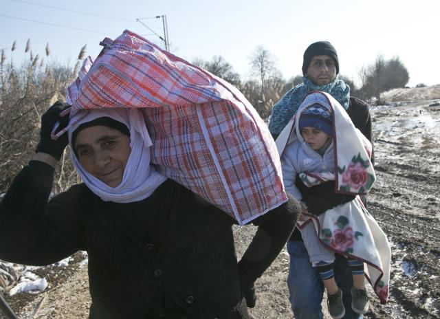 Migrants cross the Macedonia Serbia border