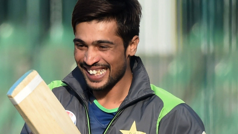 Mohammad Amir smiles during a practice session for the Pakistan Super League in Lahore