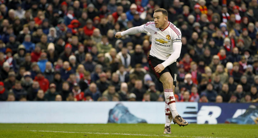 Wayne Rooney scores during the Premier League match at Anfield. P