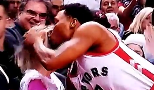 Kyle Lowry runs into fan gives her a kiss