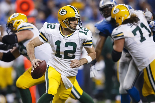 Green Bay Packers quarterback Aaron Rodgers scrambles against the Detroit Lions during an NFL football game in Detroit. The Packers play the Minnesota Vikings on Sunday Jan. 3