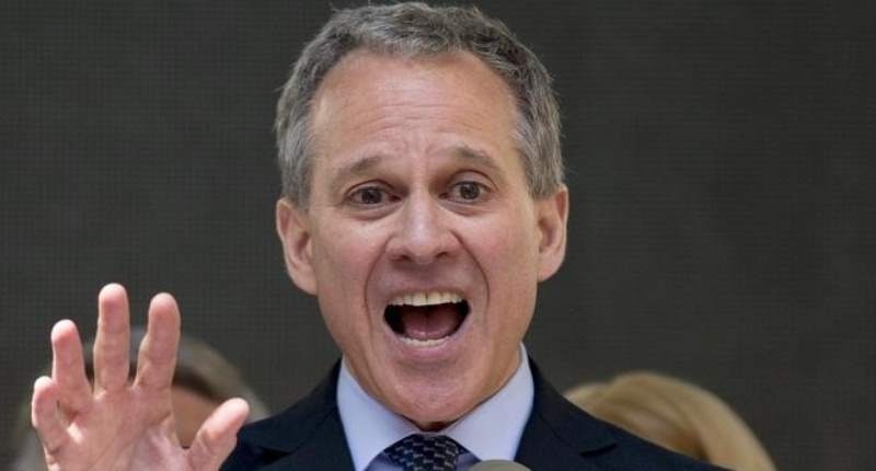 New York State attorney general Eric Schneiderman speaks at a rally to celebrate the passage of the minimum wage for fast-food workers by the New York State Fast Food Wage Board in New York