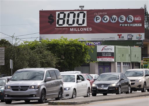 A billboard written in Spanish displayes the $800 million Powerball jackpot Friday Jan. 8 2016 in the Little Havana neighborhood of Miami. With ticket sales doubling previous records the odds are growing that someone will win Saturdays record jackp