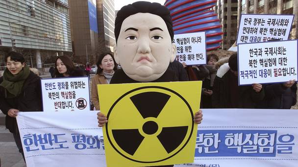 A South Korean student wearing a mask depicting North Korean leader Kim Jong Un participates in a rally after the announcement of a hydrogen bomb test